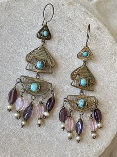 Beautiful Boho Middle Eastern Bedouin Gilt metal filigree Turquoise Amethyst Vintage Long Earrings See pictures next to ruler for scale They are tribal so earwires apear slightly thicker then modern pirced posts Ornate Purple Dangle Jewelry, Bronze Filigree Jewelry, Ornate Filigree Jewelry For Festival, Bohemian Amethyst Chandelier Earrings Gift, Bohemian Purple Filigree Jewelry, Purple Bohemian Filigree Jewelry, Bohemian Amethyst Jewelry With Intricate Design, Bohemian Amethyst Drop Earrings, Bohemian Bronze Jewelry With Intricate Design