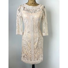 Sue Wong Cocktail Dress New With Tags Size 6, Sue Wong Sheer Dress Blush Neutral Brand New With Tags Beautiful Neutral/Blush Sue Wong Dress. Has Floral Sort Of Crochet Lace Design With Sheer Sleeves, Top Of Bodice, And Back. **Has Built In Bra So You Don't Have To Deal With Trying To Find An Uncomfortable One To Not Show Through The Sheer Back** True To Size But Is Supposed To Fit Tight. If You Are A Size 8 It Will Be Too Small Because It Hugs The Figure, Would Best Fit 4-6 Tag:6 Chest Across: L Elegant Mid-length Cream Dresses, Fitted Beige Lace Dress For Spring, Elegant Neutral Mini Length Dress, Beige Midi Lace Dress For Formal Occasions, Fitted Feminine Neutral Midi Dress, Elegant Neutral Midi Dress For Party, Beige Lace Dress For Formal Occasions, Neutral Knee-length Formal Dress, Beige Lace Formal Dress