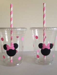 two plastic cups with pink and black minnie mouse straws