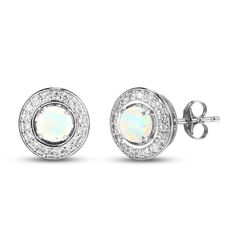 This gorgeous set showcases three lustrous pairs of stud earrings crafted in classic sterling silver. Round-cut pink, blue, and white lab-created opals glimmer in each stud. A halo of white lab-created sapphires adorn a single earring jacket, which can be worn to embellish an interchangeable pair of your choosing. The earrings secure with friction backs. Formal Round Diamond Earrings With Birthstone, White Diamond Gemstone Earrings As Gift, Formal White Earrings With Round Stones, Formal White Round Stone Earrings, Formal White Earrings, White Diamond Birthstone Earrings, Classic White Birthstone Earrings, Gift Diamond Earrings With Gemstones, White Birthstone Earrings Fine Jewelry