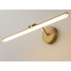 a light that is on the side of a wall with a dimmer in front of it