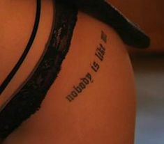 the back of a woman's thigh with an inscription on it that reads,