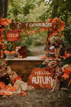 an autumn display with pumpkins and books