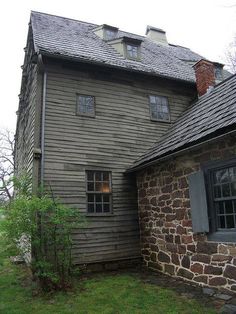 an old house with stone walls and windows