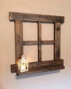 a light that is on top of a wooden window sill next to a wall