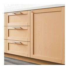 a close up of a kitchen cabinet with drawers