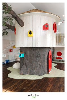 a tree house with red doors and yellow eyes on the inside is shown in this children's playroom