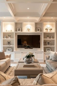 a living room filled with furniture and a flat screen tv mounted on a wall above a fireplace