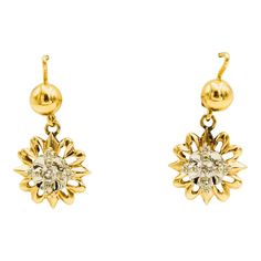 This is part of Chairish’s Fine Jewelry assortment  Highly stylized dangling flower earrings each containing a .07 carat old mine cut diamond for an approximate total diamond weight of .14 carats.  The earrings are made of 14k yellow gold. Formal Flower-shaped Diamond Earrings With Single Cut Diamonds, Formal Flower Shaped Diamond Earrings, Fine Jewelry Diamond Cut Flower Shaped Earrings, Fine Jewelry Flower-shaped Diamond Earrings, Fine Jewelry Flower-shaped Earrings With Single Cut Diamonds, Flower Shaped Diamond Earrings In Fine Jewelry Style, Formal Flower Shaped Diamond Earrings In 14k Gold, Formal 14k Gold Flower-shaped Diamond Earrings, Diamond Cut Flower Shaped Diamond Earrings