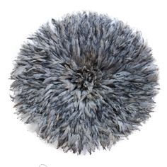 a fluffy ball of fur is shown on a white background in this image, it appears to be an odd shape