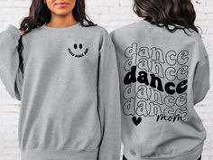 "Dance Mom Sweatshirt, Dance Lover Sweatshirt, Dancer Sweatshirt,Cute Sweatshirt,Senior Dance Mom, Trendy Shirt, Retro Smiley Dance Mom Tee Hi! Welcome to✨Northstar Sweatshirt &Hoodies✨ ✨As the weather gets colder, you want clothes that keep you and your body warm. Here, Northstar Sweatshirt &Hoodies is ready to keep you warm with its unique designs. These soft and cotton sweatshirts and hoodies can be combined with anything.✨ ✨Product Features✨ 👉Medium-heavy fabric (8.0 oz/yd² (271.25 g/m 👉Loose fit 👉Runs true to size 👉50% cotton, 50% polyester 👉Tear-away label ✨Care Instructions✨ 👉Wash item inside out in cold water, do not bleach, do not dry clean, do not iron directly on the design. ✨How To Order✨ 👉 First, please review all photos and make sure you read the descriptions. 1- Choos Long Sleeve T-shirt With Letter Print For Dance, Long Sleeve Letter Print T-shirt For Dance, Crew Neck Graphic Print Sweatshirt For Dance, Graphic Print Crew Neck Sweatshirt For Dance, Hip Hop Crew Neck Top For Dance, Long Sleeve Graphic T-shirt For Dance, Hip Hop Long Sleeve Sweatshirt For Dance, Hip Hop Style Crew Neck Top For Dance, Long Sleeve Graphic Print T-shirt For Dance