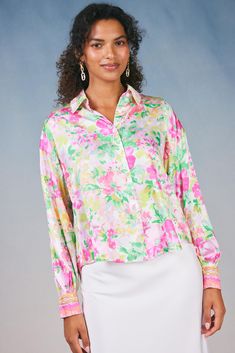 An artful floral print blooms on this button-up shirt. Done in a loose, slightly cropped silhouette, it's got billowy long sleeves for a dramatic effect. •Classic fit •Button front placket •Long sleeves with button closure Item number 2430032 50% Polyester 50% Recycled Polyester Gentle cycle cold Botanical Watercolor, Pink Blouse, Trending Dresses, Pink Bag, Item Number, Button Up Shirts, Floral Print, Button Up, Floral Prints