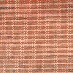 an orange brick wall is shown in this image