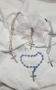 · Top Quality Rosary Bracelet · Features a beautiful Silver cross at the end · Size: 6" Long · Style: Silver Cross with Beads · Use For: These bracelets are very delicate, beautiful and perfect for decoration, Communions, christening, party favors, baptism. Cross Crucifix Jesus Christ Religious Ladies Bracelet. What better way to show your religious faith than by wearing this religious bracelet. This is the perfect religious gift for your sister, mother, wife or friend! Available in pink and whi Adjustable Cross Bracelets For Wedding, Adjustable Cross Bracelets For Weddings, Adjustable Cross Rosary Bracelet For First Communion, Beaded Cross Jewelry For First Communion, Cross-shaped Beaded Jewelry For First Communion, Adjustable Cross Jewelry For Wedding, Adjustable Beaded Rosary Bracelet With Crucifix, Beaded Cross Rosary Bracelet Gift, Gift Beaded Cross Rosary Bracelet