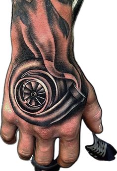 a man's hand with a tattoo on it