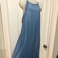 New Appraisal Long Denim Dress 100% Lyocell Spaghetti Strap, Size L (Nwot) This Of-The-Moment Denim Dress Is Long And Lean. Made Of Super Soft Lyocell Fabric, It Has Racer Back Spaghetti Straps, A High Scoop Neck A Side Zip, And Ties In The Back. The Hem Has A Pretty Frayed Fringe Finish. Perfect For Any Spring/Summer Gathering. (Nwot) Size: Bust: 21” Hips: 24” Length: 41” Summer Stretch Denim Blue Dress, Stretch Denim Blue Dress For Summer, Summer Stretch Denim Dress In Medium Wash, Summer Stretch Medium Wash Denim Dress, Spring Stretch Denim Midi Dress, Spring Stretch Denim Blue Denim Dress, Spring Stretch Denim Blue Dress, Spring Vacation Denim Dress In Medium Wash, Summer Stretch Denim Dress