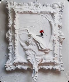 a painting with white paint and a red figure on it