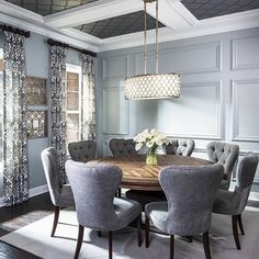 the dining room table is surrounded by gray chairs