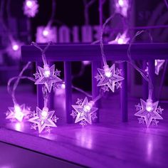 purple christmas lights on a wooden table