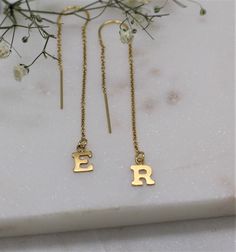 "Get personal with this letter threader earring in 14 carat gold filled or sterling silver. Get one or Buy 2 of the same, or, add 2 different initials to your basket to create a unique look. Choose your kids initials, your loved ones or go for O and X for hugs and kisses. So comfy you never need take them off Layer up with our matching initial hoops L E T S . T A L K . E A R R I N G S ✤ Available in 14k gold filled and Sterling Silver ✤ Available in one size - From the ear lobe it hangs approx 3 Personalized Yellow Gold Earrings For Everyday Wear, 14k Gold Filled Threader Earrings As Gift, Personalized 14k Gold Earrings For Everyday, Everyday Personalized 14k Gold Earrings, Silver 14k Gold Threader Earrings As Gift, Yellow Gold Threader Earrings As A Gift, Yellow Gold Threader Earrings For Gift, Gold Dangle Threader Earrings For Anniversary, Hypoallergenic Yellow Gold Threader Earrings Gift