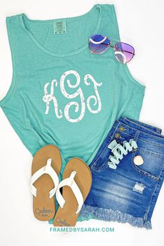 Show off your personal style in this Turquoise Monogrammed Tank. The beautiful pastel cursive monogram style provides a modern look and this unisex tank will keep you cool in in our warm weather all summer! The monogram is optional but is included in the price. Green Summer Tank Top With Letter Print, Green Letter Print Tank Top For Summer, Summer Tank Top With Letter Print For Everyday, Summer Letter Print Tank Top For Everyday, Casual Turquoise Tank Top For Summer, Summer Monogram Print Tops, Casual Turquoise Top For Beach Season, Summer Cotton Tops With Monogram Print, Summer Cotton Monogram Print Tops