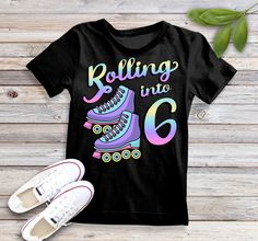 a t - shirt that says rolling into 6 with roller skates on it