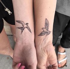 two small birds tattoo on both wrist