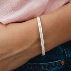 This everyday 14K white or yellow gold bangle bracelet adds a touch of sheer brilliance to any look, whether it's worn solo or stacked with other accessories. The versatile design allows you to mix and match and make it your own. Natural Diamond: 1.55ctw 14K White or Yellow Gold Width: 4.5mm Wrist Size: 46 x 56mm (small-medium) Mavilo Exclusive White Gold Tennis Bracelet Bangle For Everyday, Elegant White Gold Bangle For Everyday, Timeless White Bracelet For Everyday Luxury, Dainty Everyday Luxury Bangle Bracelets, Minimalist White Gold Bangle For Everyday Luxury, Hand Set Bracelets For Everyday Luxury, Everyday Luxury Dainty Bangle Bracelet, Everyday Diamond Cut Bracelets, Dainty Bangle Bracelets For Everyday Luxury