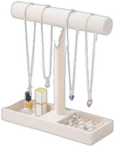 a white jewelry holder with three necklaces and two rings on it's sides