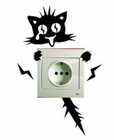 an electrical outlet with a black cat on it's face