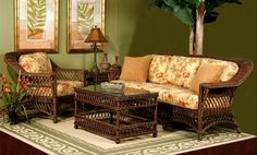 a living room filled with lots of furniture next to a brick wall and window sill