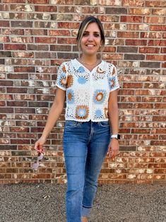 Add some bohemian flair to your wardrobe with our charming crochet top! This vintage-inspired piece features intricate detailing and a button-down front, perfect for warmer days. Embrace elegance with a touch of playfulness in this must-have top. Color: White, Orange and Blue Fabric: 60% Cotton, 40% Acrylic Includes: x1 Top Sizes: S/M, M/L Length: 20" - 20.5"Model is 5'10" and wearing a size small (33-23.5-35) Fall Crochet Top For A Day Out, Bohemian Crochet Top For Fall Day Out, Spring Crochet Top With Crochet Trim For Day Out, Vintage Open Knit Tops For Summer, Spring Crochet Lace Top For Day Out, Spring Bohemian Open Knit Blouse, Casual Open Knit Blouse, Fitted Open Knit Casual Blouse, Vintage Crochet Trim Tops For Spring