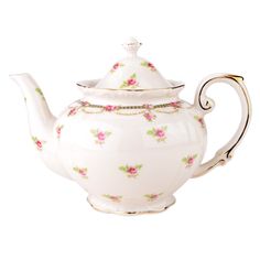 a white teapot with pink flowers on it and a gold trim around the top