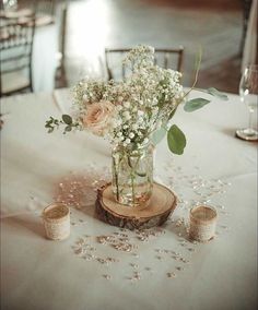 a vase filled with flowers sitting on top of a table