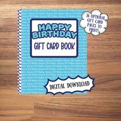 a happy birthday gift card book sitting on top of a wooden table