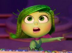 an animated character with green hair and big eyes pointing at something in the air while standing on a keyboard