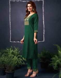 Dark Green Cotton Sequence Straight Kurta Set With Dupatta  Dark Green Cotton Sequence Straight Kurta Set With Dupatta is a glamorous and sparkling ensemble. The intricate sequence work, often arranged in floral motifs or geometric patterns, adds a dazzling shimmer to the kurta. The straight cut provides a modern and streamlined silhouette, while the accompanying dupatta can be styled in various ways to complete the look.  Features Of Dark Green Cotton Sequence Straight Kurta Set With Dupatta  T Festive Green Pant Set With Traditional Drape, Festive Green Traditional Drape Pant Set, Green Fitted Designer Pant Set, Traditional Embroidered Green Pant Set, Designer Green Pant Set With Zari Work, Festive Green Pant Set With Resham Embroidery, Fitted Green Pant Set With Resham Embroidery, Green Zari Work Pant Set For Diwali, Green Bollywood Pant Set With Resham Embroidery