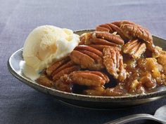 pecans and ice cream are on a plate