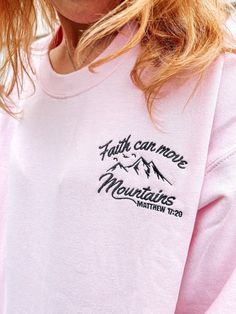 Get ready to fall in LOVE with your Faith Can Move Mountains embroidered cute Christian sweatshirt. It's the cutest and most comfortable way to share your God's love with others. Also makes a great gift!  * PRODUCT DETAILS * ✺ Soft preshrunk 50% cotton, 50% polyester blend ✺ Medium weight fabric (super soft feel) ✺ Wash and dry normally (on cool for best results) ✺ Designed and printed in the USA ✺ Due to different monitor screens, colors may vary ✺ * SIZING * ✺ FOR AN OVERSIZED FIT, SELECT TWO Cute Embroidered Text Tops For Fall, Cute Tops With Embroidered Text For Fall, Cute Crew Neck Sweatshirt With Embroidered Logo, Cute Winter Tops With Embroidered Text, Cute Embroidered Winter Tops, Pink Tops With Embroidered Text For Winter, Winter Pink Top With Letter Embroidery, Pink Top With Letter Embroidery For Winter, Pink Letter Embroidery Top For Winter