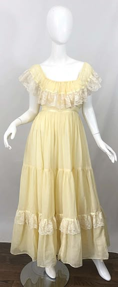 For Sale on 1stDibs - Amazing 1970s pale yellow and white cotton voile and lace boho empire maxi dress! Features white lace around the bodice and at the ruffle hem. Can be worn Lace Yellow Dress, Sewing Vintage Dresses, Vintage Chiffon Dress, 70s Dress Style, Yellow Dress Aesthetic, Field Clothes, Long Cotton Dresses, Casual Long Dresses, Empire Fashion