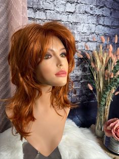 "This wig is life! For all those out there with a zest for life, loving that bold retro shag. Wear her bangs forward or sweep them off to the sides. Shake, tease and mist with Tressalure Wig Wax for volume and hold.  She has magnificent, steep layers throughout with lots of volume all over. Her color is a bright copper that works with light or dark eye colors! She fits heads up to 22\" with her fully machine made capless design and lots of permatease.  Fluff her up for a night out, smooth her down for a daytime look.  Two adjustable back straps, no combs or clips.  She measures 14\" at her longest with full layering and graduation.  Her fibers are low heat friendly up to 250 , moist heat only. You can give her a spritz of water and put in some hot rollers. Leave overnight.  She is as easy Good Quality Wigs, Moist Heat, Zest For Life, Hot Rollers, Bright Copper, Quality Wigs, Custom Wigs, Hair Replacement, Dark Eyes