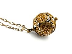 "Unusual 21-inch antique necklace: a 10k pierced ornate filigree globe pendant on an antique 8ct chain. The jump link was added later but it's antique and marked 14k. The vintage gold-filled clasp is a replacement. Measurements: 5/8\" wide x 1 1/16\" high Weight: 5.41g NEC.INS_0004.23 FREE DOMESTIC STANDARD SHIPPING Another Sky Vintage Home Page https://www.etsy.com/shop/AnotherSkyVintageLLC?ref=hdr_shop_menu PA residents will have 6% sales tax added where applicable. Other states charge taxes on online purchases as well. Buyers will find these are added to the bill automatically by Etsy, wherever they apply. INTERNATIONAL SHIPPING: Dear international buyer, please be aware of Customs laws and duties and import taxes in your country so as to be prepared for Customs charges where they apply Antique Pendant Necklace For Formal Occasions, Formal Brass Jewelry With Intricate Design, Elegant Locket Necklace For Ceremonial Occasion, Formal Intricate Brass Jewelry, Collectible Yellow Gold Necklace With Intricate Design, Collectible Yellow Gold Necklaces With Intricate Design, Collectible Intricate Yellow Gold Necklace, Victorian Round Necklace With Antique Finish, Victorian Round Necklace With Intricate Design