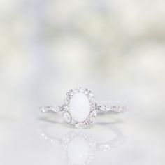 Vintage – Milk Couture Co. Timeless White Cluster Ring With Rose Cut Diamonds, Elegant Flower Ring With Rose Cut Diamonds For Wedding, Elegant Wedding Flower Ring With Rose Cut Diamonds, Elegant White Flower Ring With Diamond Accents, Classic White Cluster Ring With Halo, Elegant Silver Opal Ring With Halo Design, Elegant White Flower Ring, Delicate White Diamond Ring With Diamond Accents, Delicate White Rings With Diamond Accents