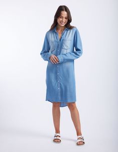 DESCRIPTION Introducing the Cleo Vintage Denim dress by White & Co. This must-have Spring wardrobe essential brings effortless style with its laid-back, vintage look. Crafted from soft, lightweight, breathable tencel denim, this shirt dress features a button-down front, twin chest pockets, and a flattering curved hem. Perfect for those days when you want to look chic without trying too hard. Pair the Cleo Vintage Dress with white sneakers for a casual day out, or dress it up with strappy sandals Dress With White Sneakers, Vintage Denim Dress, Spring Wardrobe Essentials, Trying Too Hard, Tencel Denim, Denim Shirt Dress, Spring Wardrobe, Vintage Dress, Look Chic