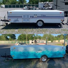 an rv parked in a parking lot next to another vehicle with the trailer painted blue and white