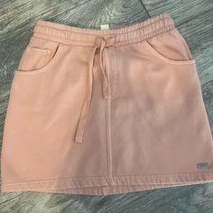 Roxy Tie Mini Skirt Light Pink / Coral Xs Missing Tag But Never Worn. Still Has Plastic Cotton Casual Pink Mini Skirt With Pockets, Casual Short Mini Skirt, Casual Pink Cotton Skirt, Casual Short Pleated Skirt, Casual Short Cotton Skirt, Pink Cotton Skort With Elastic Waistband, Casual Pink Mini Skirt, Casual Short Skirt, Pink Coral