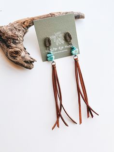 Add a classy touch of boho style to your looks with the Courino Earrings! These pretty pairs dangle faux leather tassels as it adds a pop of difference to any look. They are handcrafted with materials that come from Brazil and are ready to be styled perfectly! Brown Tassel Earrings For Festivals, Adjustable Brown Bohemian Tassel Earrings, Elegant Brown Adjustable Tassel Earrings, Bohemian Teardrop Wrap Earrings, Adjustable Teardrop Bohemian Wrap Earrings, Chic Adjustable Tassel Earrings, Adjustable Fringe Tassel Dangle Earrings, Bohemian Adjustable Tassel Dangle Earrings, Bohemian Adjustable Tassel Earrings With Fringe