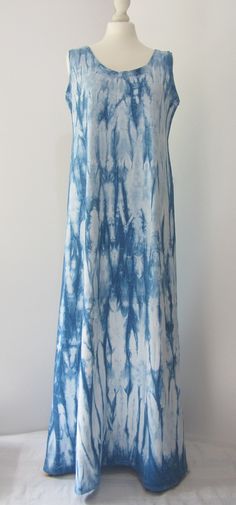 "Beautiful, flattering Indigo tie-dyed long dress, made in England from high-quality stretch organic cotton. Dyed with Indigo with a beautiful and interesting tie-dye pattern. As is the nature of Tie-Dye this is a completely one-off design. This easy-to-wear sleeveless long dress has a fitted but flattering silhouette, long sleeves. The natural fabric of this dress is soft and cool and the slight stretch in the cotton will ensure it keeps its shape. Great for any time wear, daytime, evening or night.   Made and dyed in the UK  from GOTS (global organic textile standard) stretch cotton, from Turkey. Dress length  137cm/54\" Will fit size 12-14" Indigo Tie Dye, Cotton Long Dress, Sleeveless Long Dress, Natural Fabric, Indigo Dye, Tie Dye Patterns, Tie Dyed, Natural Fabrics, Beach Dress