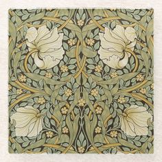 an intricately designed wallpaper with flowers and leaves in green, yellow and white