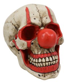 a creepy clown mask with a red nose